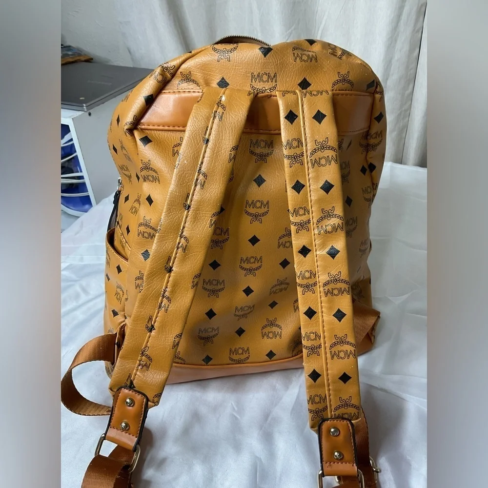 MCM Tan Backpack with Iconic Monogram Design